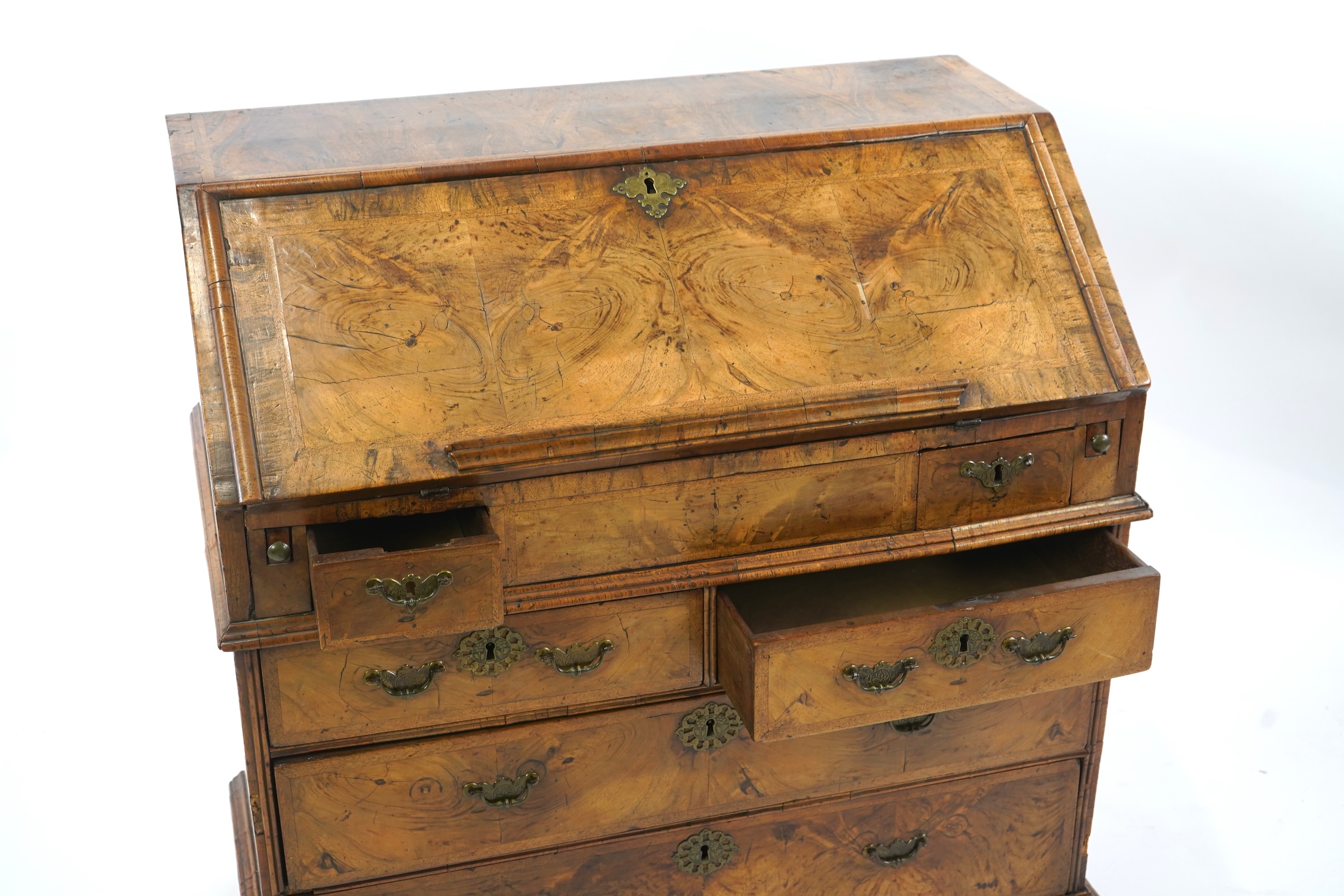 A George I feather banded walnut bureau
